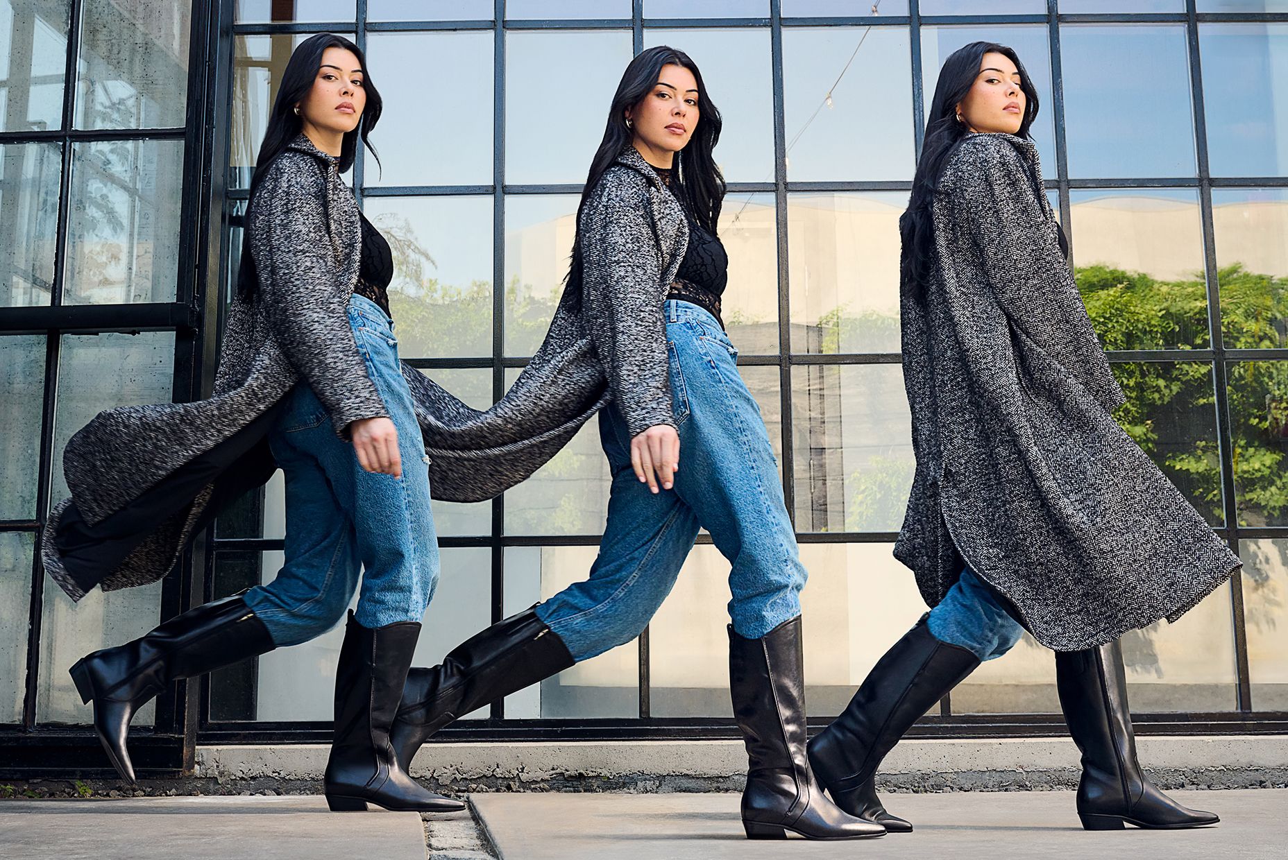 model wearing knee high black Naturalizer boots